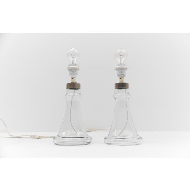 Pair danish Table Lamps in Clear Glass by Michael Bang for Holmegaard, 1960s The lamps are executed with E27 Edison screw...