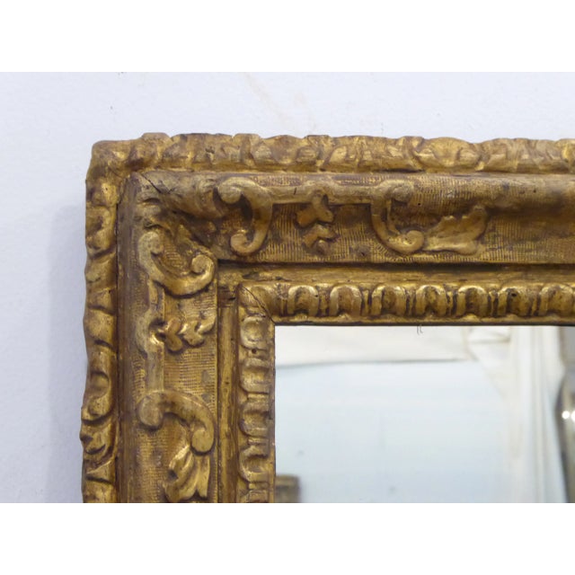 18th Century Continental carved giltwood mirror, 31"H x 24.75"W.