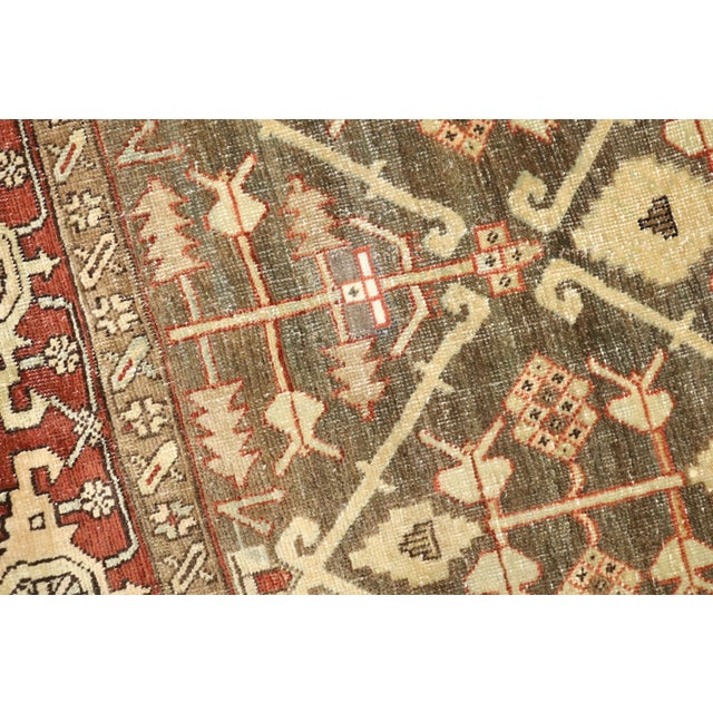 Fine quality Persian Heriz rug with an all-over design in greens and brown, circa 1920. Measures: 4'4" x 5'7".