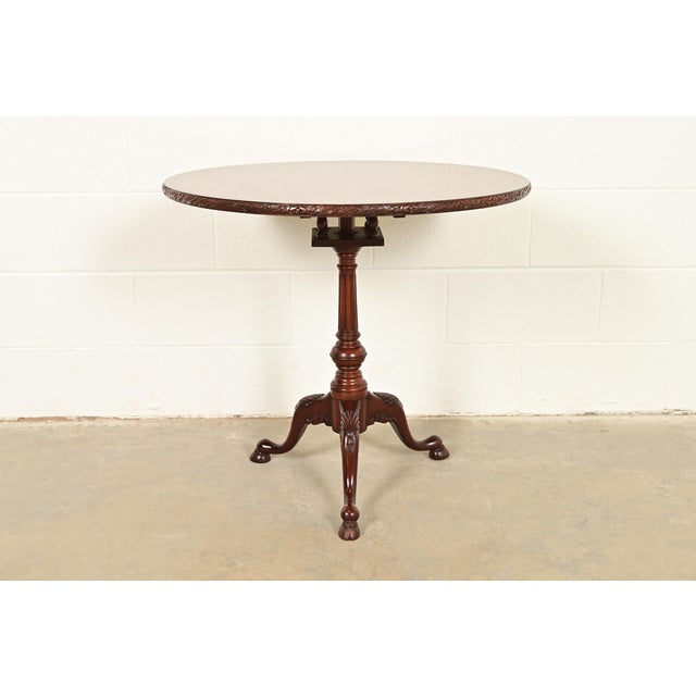 A gorgeous Georgian or Chippendale style pedestal tea table or side table By Smith & Watson USA, Circa Mid-20th Century...