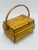 This charming vintage bamboo and rattan lidded basket showcases the natural beauty of handcrafted tropical materials....