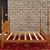 A vintage American Traditional solid oak queen poster bed having turned and twisted posts and finials, an arched panel...