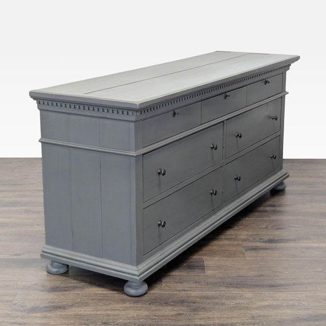 This Restoration Hardware dresser features a sleek gray finish and classic design. It has seven spacious drawers, perfect...