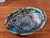 An exquisite large vintage abalone shell showcasing a spectacular display of natural iridescence in shimmering shades of...