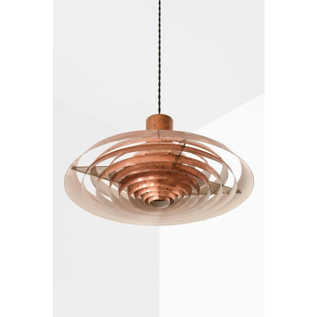 The rare langelinie ceiling lamp, designed by poul henningsen and produced by louis poulsen in denmark, is an outstanding...