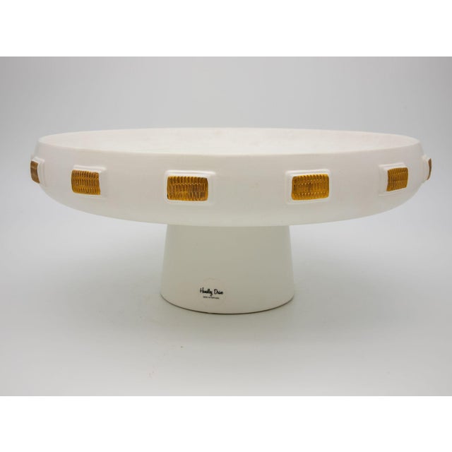 A striking 2016 ceramic pedestal platter by Handley Drive, made in Portugal. The piece features a broad, shallow circular...