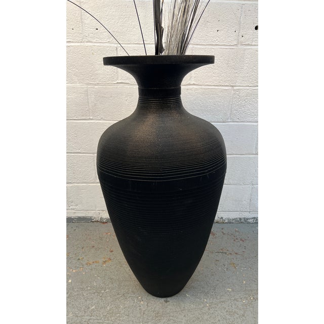 Corrugated cardboard vase rendered in matte black by Flute, Chicago circa 1980s. Best to use with dried arrangements....