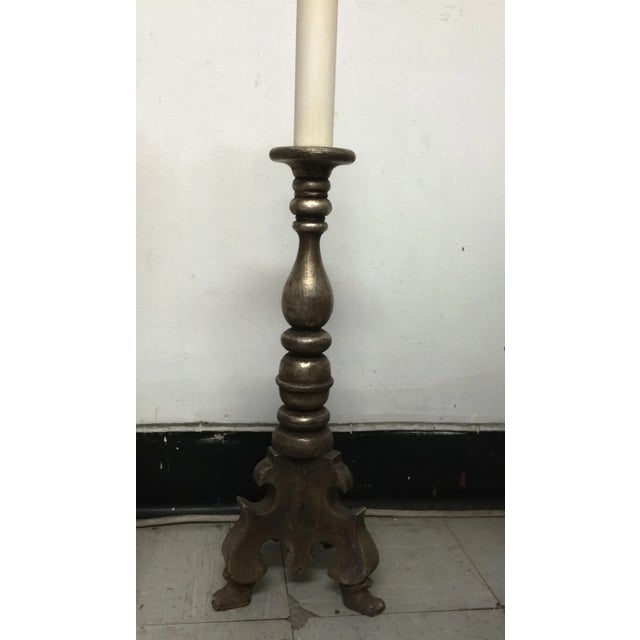 A simple and elegant transitional piece for any room. This lamp is finished in genuine silver leaf over grey bole clay,...