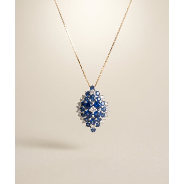 14K gold pendant necklace with clustered blue sapphires and diamonds 14K gold chain with spring-ring clasp Box Chain...