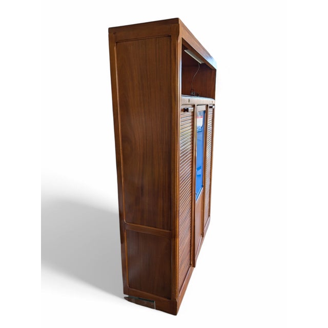 Antique double shutter filing cabinet from the 1960s. Built entirely in oak wood and central door in blue plastic....