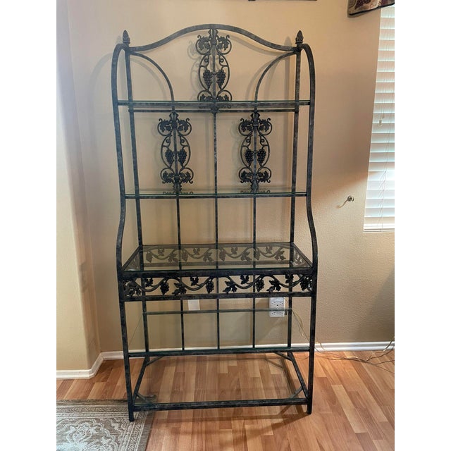 This late 20th century replica étagère features a refined Neoclassical Revival design rendered in what appears to be...