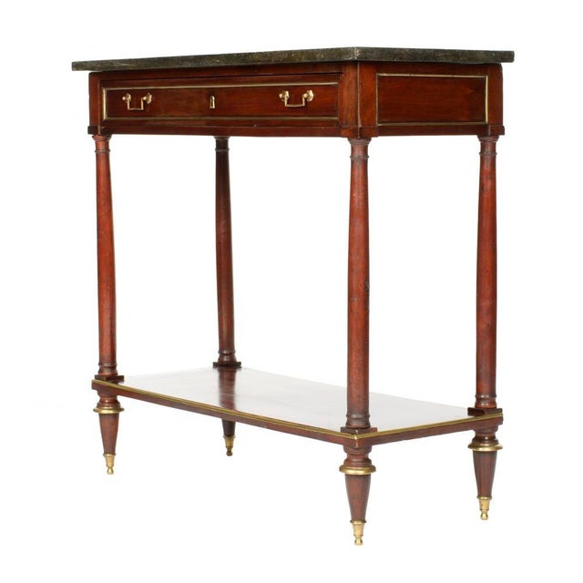 Elegant French Louis XVI Mahogany Console Table with Marble Top. Table features a rich mahogany case fitted with a single...