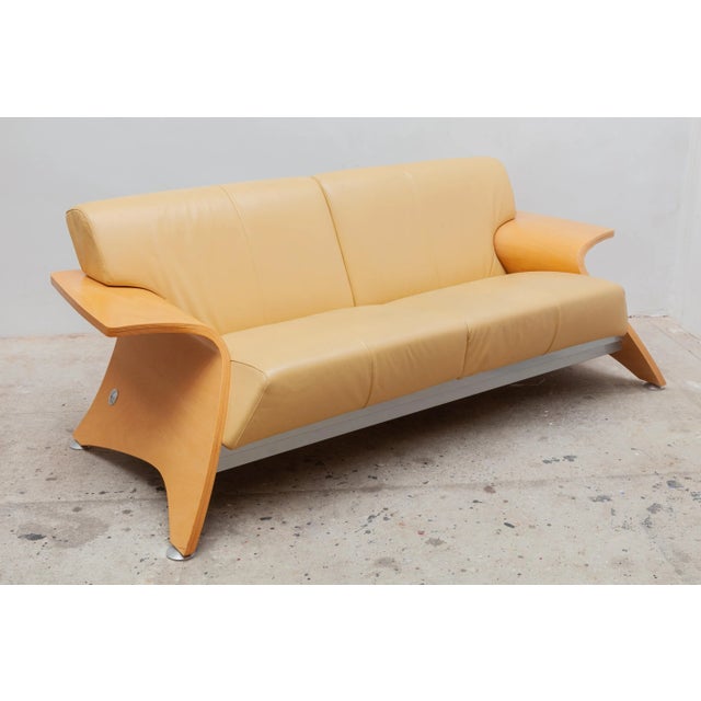 Vintage 1980s Postmodern two-seat sofa. Sculpted beech frame with aluminum accents. Original warm yellow cream leather...