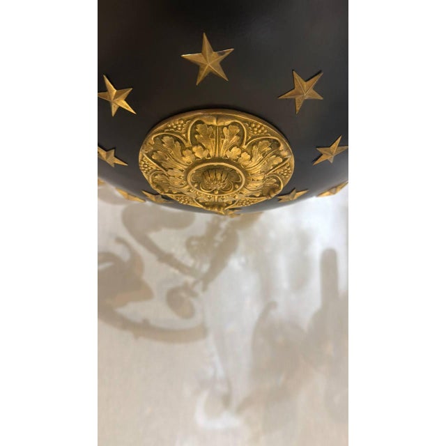 Late 19th century French Empire style chandelier with gilded swans heads and stars. Newly UL rewired