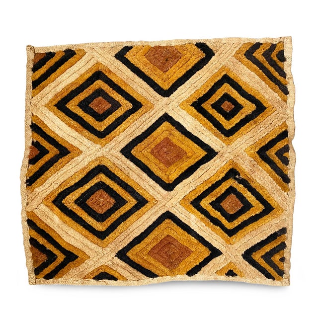 Traditional vintage Kuba grass textile handmade from the indigenous people of the Congo. Bold geometric patterns created...