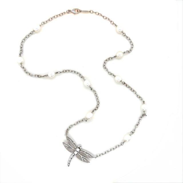 A delicate design by Tiffany & Co., celebrating nature’s elegance. The necklace features luminous cultured pearl stations...