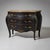 Chest of drawers with a serpentine carcass and three drawers. Dark-painted carcass with a fitted marble top. The piece...