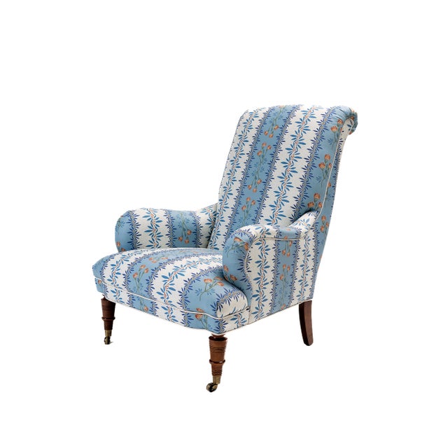 Antique highback chair with casters, with a deep seat, tall back, wide arms – comfortable and roomy. Upholstered in...