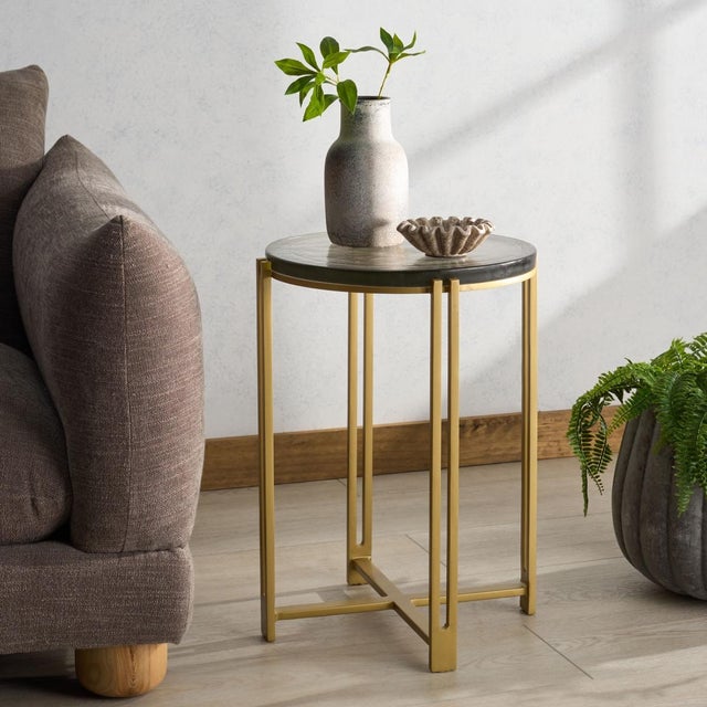 Introducing the Levitt Cast Glass Top Accent Table, a piece poised to enrich your home environment. Crafted meticulously...