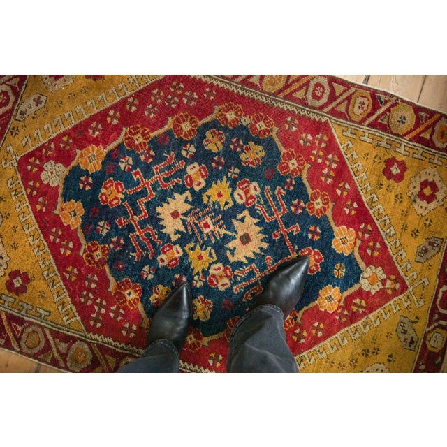 :: Central floral filled main medallion with trident contoured vines atop a covered floral top view main field enveloped...