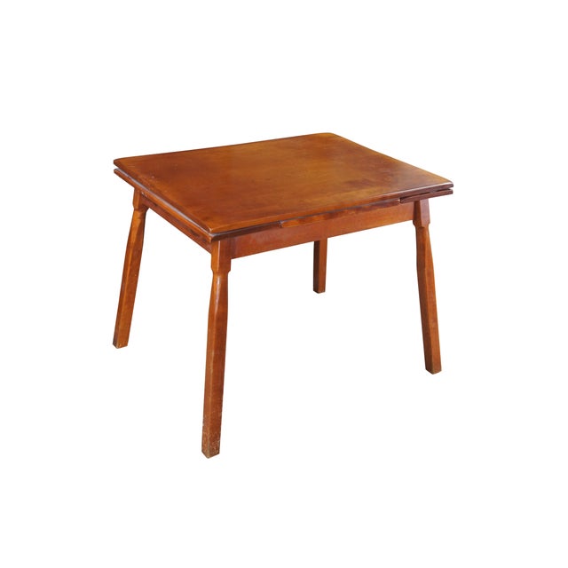 A Quaint Mid Century Attributed to Heywood-Wakefield Dining Table. Features a rectangular frame made from maple with two...