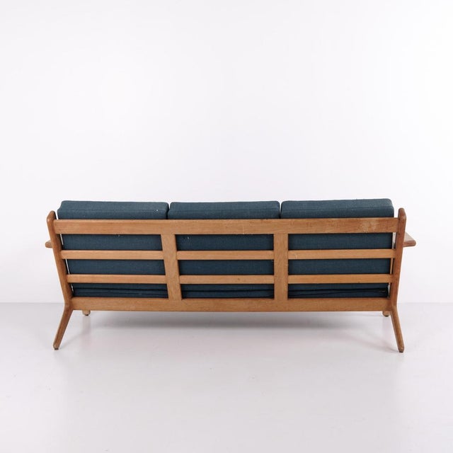 Three seater sofa model ge-290/3 designed by hans j. Wegner and produced by getama. The sofa is made in soap treated oak...