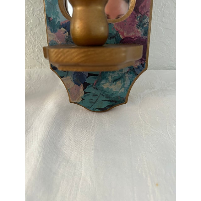 Lovely pair of 1990s mirrored wood hanging wall sconces in a floral design. Each holds one taper candle. Great condition.
