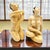A cohesive pair of vintage Japanese figural sculptures depicting bathing beauty subjects, executed in smooth cast resin...