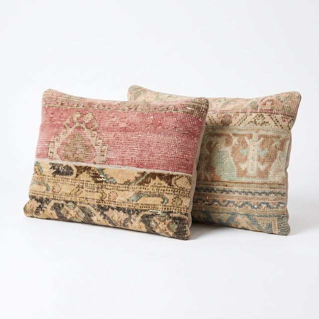 This 16'' x 24'' pillow cover set was made from authentic Turkish rug pieces — patchwork panels of faded red and gold rug...
