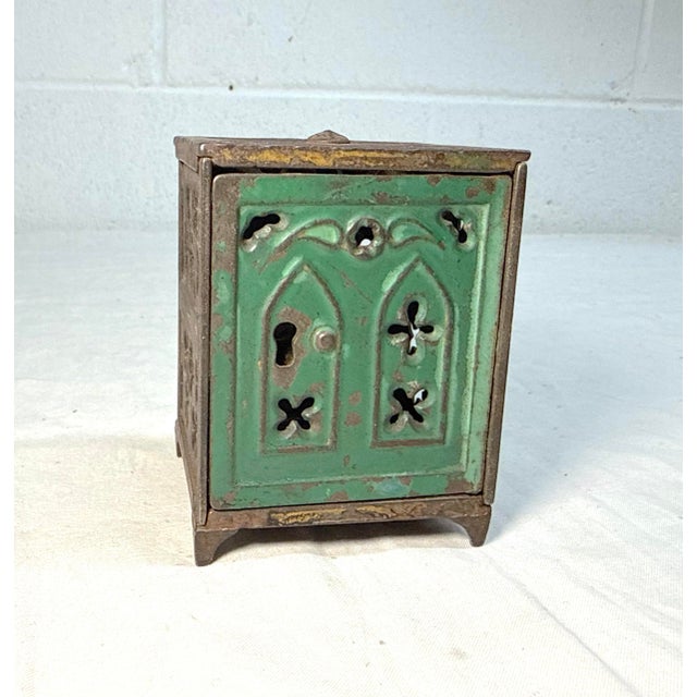 The Antique 19th century cast iron church window still bank is a unique and original collectible piece crafted in the...