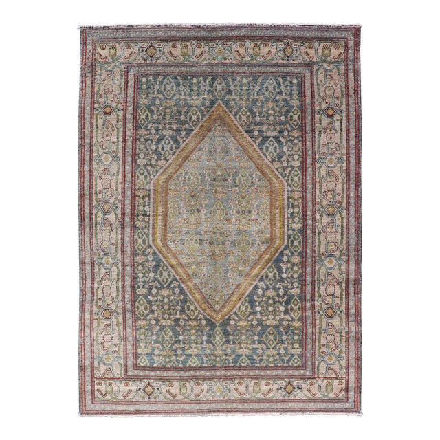 Antique Persian Senneh Rug With Soft Blue Field and Geometric Medallion For Sale