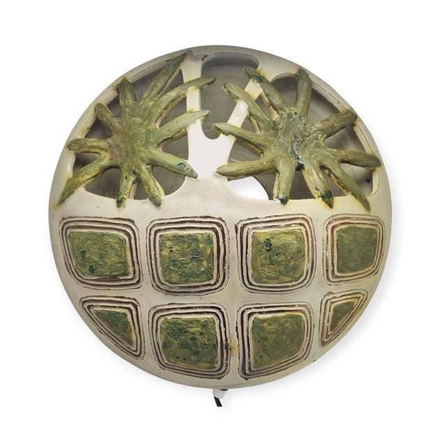 Ceramic wall lamp decorated with green flowers on a white background, from the 1960s. Handmade, unique designed. Available...