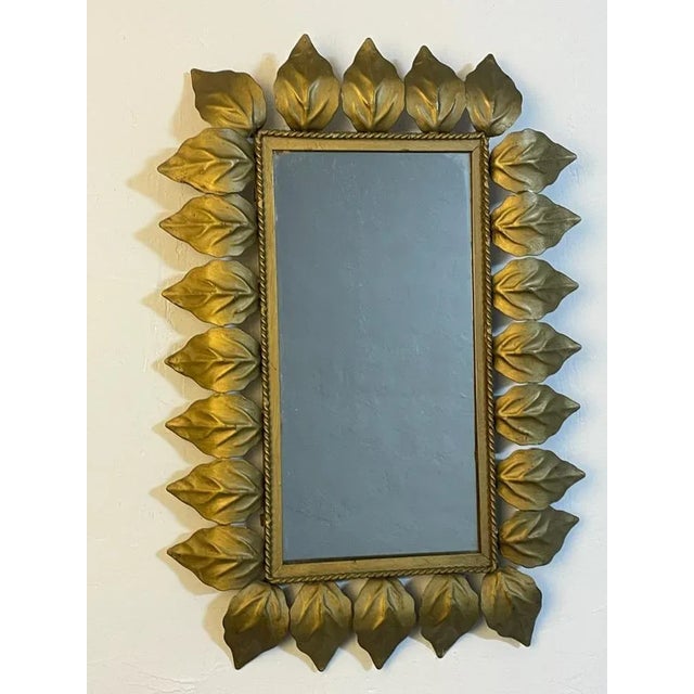 Magnificent rectangular sun mirror in wrought iron from the 1950s. Good condition.