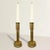 A wonderful and thought provoking pair of mid 20th century American Folk Art candlesticks made from reused brass.