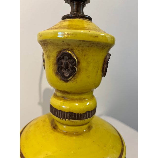 A Pair Mid-Century of original 1960's Vibrant Yellow Glazed Stoneware Table Lamps with brown accents. The pottery lamp is...