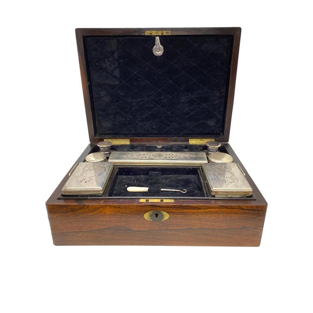Antique rosewood travel box, with inlaid brass, the fitted interior complete with all items, including brushes, bottles,...