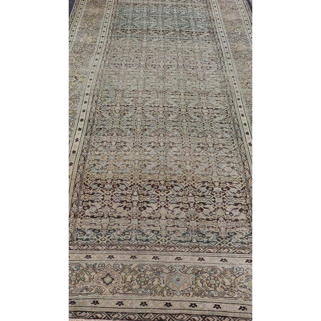 Measures: 6'3 x 16'3. Gallery Persian Malayer with all-over geometric design in gray, brown, blue, tan, green. Malayer...