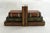 Pair of trompe-l'oeil bookends depicting stacked books, angular in shape formed from faux antique books, which also...