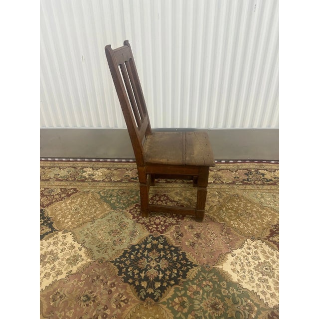 Elevate your space with a touch of rustic nostalgia courtesy of our Antique Farm Wooden Chair. Each curve and grain tells...