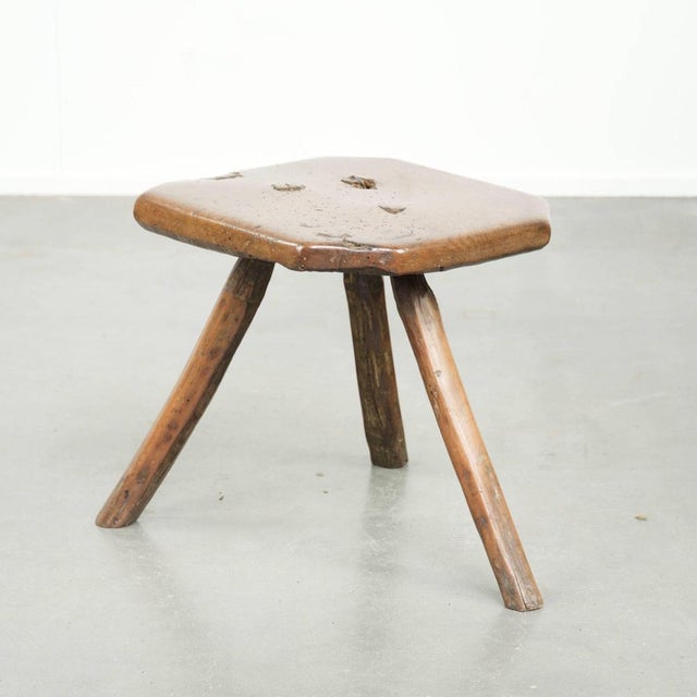This unique and original antique English farmhouse stool/side table/coffee table dates from the 17th century and is a...