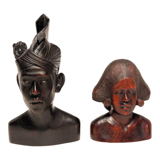 A Pair of Vintage Hand Carved Wooden Indonesian Woman and Man Busts For Sale