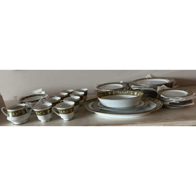 Beautiful China place settings for 8. Flanders pattern- Forest green with gold trim on white. Made in Japan by Noritake....