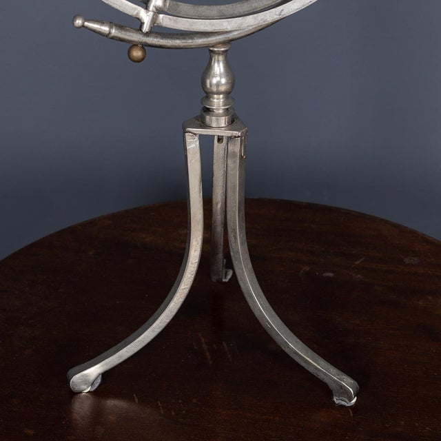 A 20th Century Copernican Armillary Sphere crafted in polished steel and brass. This instrument illustrates the celestial...