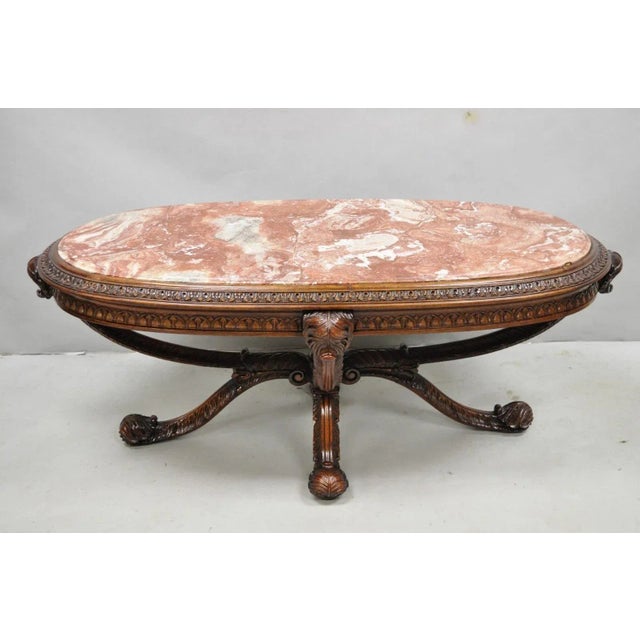 Antique Grosfeld House (attributed) French Regency Style Prince of Wales Plume Carved Oval Mahogany Coffee Table with Pink...