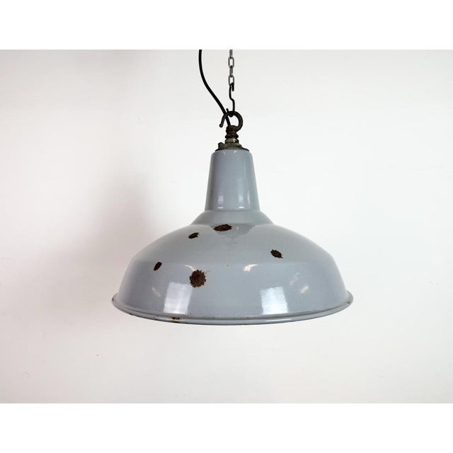 Industrial grey enamel factory pendant light made in united kingdom during the 1960s. White enamel inside the shade. Iron...