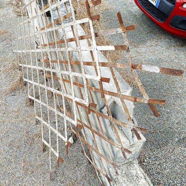 Set of early 20th century hand-made iron window grilles with bolted joints, they show signs of age with white painted...
