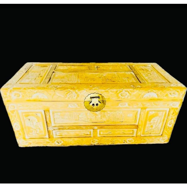 A traditional style of Chinese carved chest/trunk. All wood and brass construction. A beautiful butter yellow finish. The...