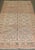 Gray salmon color 1930s Khotan rug with a pomegranate motif throughout