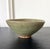 An antique Korean ceramic bowl with celadon glaze from Goryeo Dynasty circa 12th-13th century during the artistic zenith...
