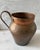 Antique copper jug or urn type vessel with a handle. Unusual construction with joined halves by a brass zipper like joint....